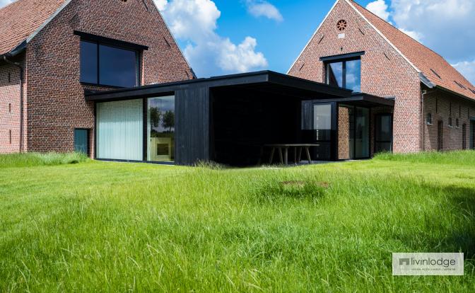 Modern timber-frame extension in charred wood