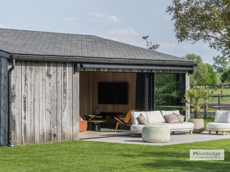 Outbuilding in reclaimed barnwood, blending perfectly with nature