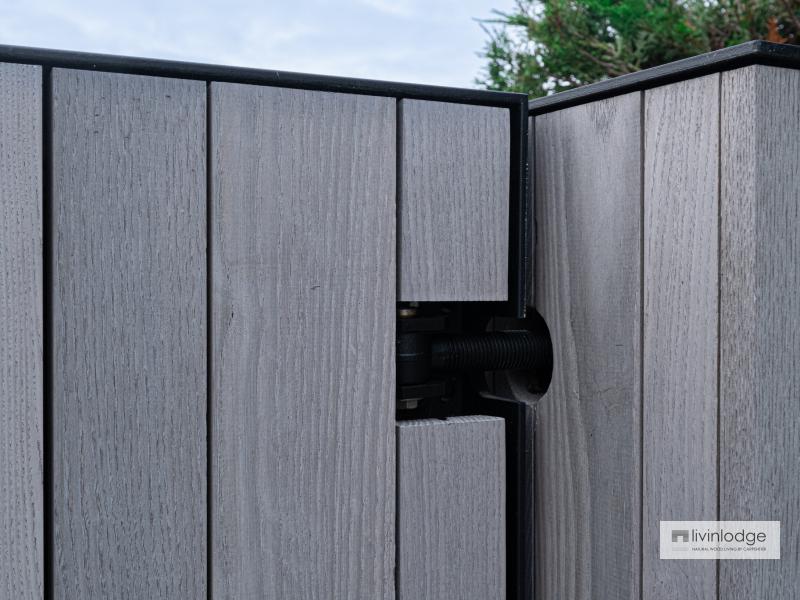 Detail of wooden gate with imposing gateposts