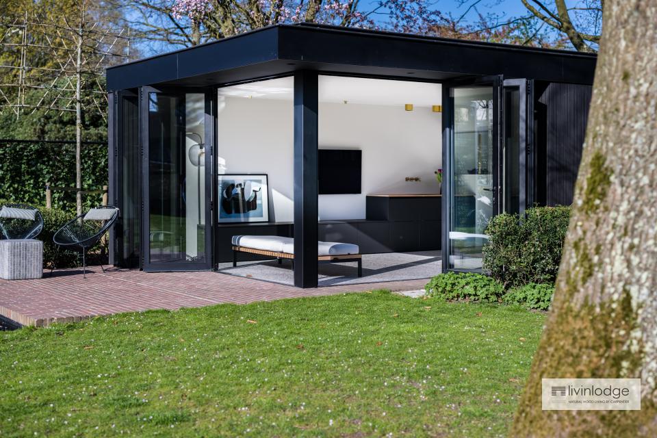 Modern pool house with large glass doors and a refined black finish