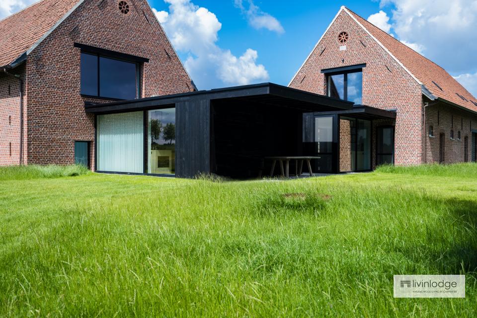 Modern timber-frame extension in charred wood