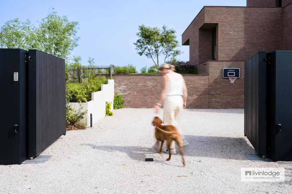 Wooden swing gate, finished in black